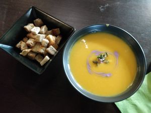 Starter: pumpkin/coconut soup with croutons at Nom Nom in Bucharest