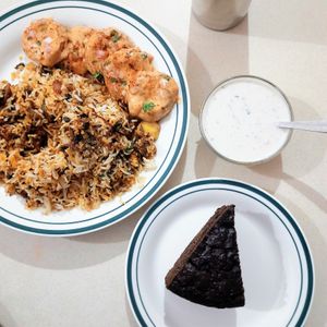 Mushroom dum biryani, raita, chcoo banana cake at Simplifry in Bangalore