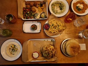 hummus, falafel, crispy fries, cauliflower, pita at Café NIL in Vienna