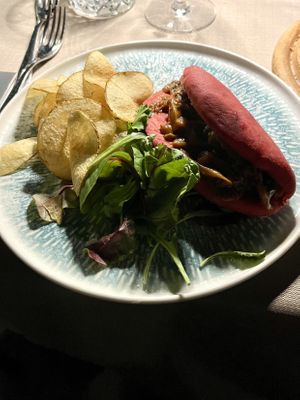 Bao bun stuffed with barbecued mushrooms, Villa Costanza micro greens, and fresh chips/crisps.  at Villa Costanza in Palermo