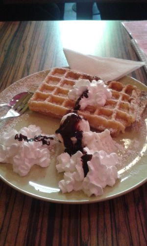 Waffle with bounty ice cream,  whipped cream and chocolate topping - all vegan!  at Kiez & Kugel in Berlin