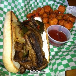 argentine po-boy: strips of seitan mock steak sauteed with caramelized peppers and onions, vegan mayo and a spicy chimichuri sauce. at Green New American Vegetarian in Tempe