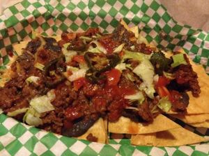 (current special) Faux-Sho Nachos: 'beefy' taco 'meat', black beans, lettuce, salsa, sautéed jalapeños (sour cream, tomatoes & cheese also available)  at Green New American Vegetarian in Tempe