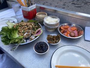 Laab tofu, jeow bong (darker color), jeow eggplant (lighter color), sticky rice, and pickles—this was a good amount of food for 2. We took some of the jeow bong and pickles home. at Gai Noi in Minneapolis