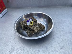 The black sesame mochi dessert. Small (esp for $9) but really tasty. Hot/crispy with soft/chewy interior (similar to sesame balls).  at Gai Noi in Minneapolis