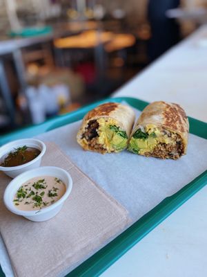 Another shot of our heavenly vegan Sunrise Burrito with fresh avocado added! (No longer served with arugula)  at Whale Bites Cafe in Depoe Bay