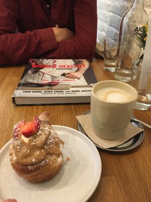 Favorite pastry ❤️ and a cool book we discovered in the cafe   at botànic in Barcelona