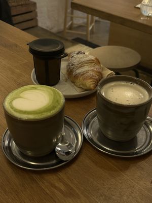 Matcha latte, chocolate croissant and tea  at botànic in Barcelona