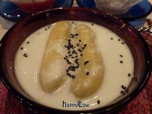 Banana dessert with hot coconut milk at Na Aroon in Bangkok