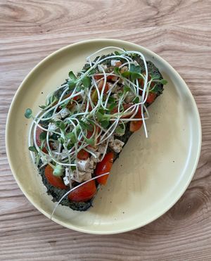 Pesto toast with tofu feta cheese, baby tomato and sprout at IVEGAN SUPERSHOP BEN THANH - Healthy Plant Based Cafe in Ho Chi Minh City