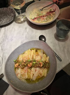 Leeks in vinaigrette with kimchi cream & Ravioli with crispy kale and hazelnut  at La Huerta Funky Castizo in Madrid