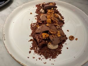 "KINDER MALO": HAZELNUT CREAM, CHOCOLATE CAKE, EVOO SORBET WITH CUZCO CHOCOLAT, BEET AND COCOA CRUMBLE. at La Huerta Funky Castizo in Madrid