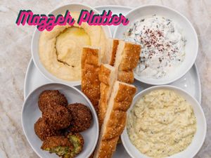 Our 3 dips: The Perfect Hummus, Kale and Spinach Borani, and Persian Eggplant Dip, with Falafel and our locally baked Barbari Bread. at ZOOD in Newport Beach