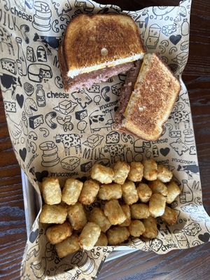 Vegan patty melt with tater tots  at I Heart Mac & Cheese in Highland Village