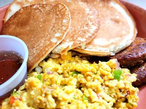 Breakfast of Champs ~
3 pancakes, 2 *Beyond Meat* sausages, *Just Eggs* scrambled w/onions & peppers.  at aneeD for Vegan in Norfolk