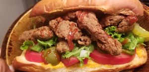 CFM SAMMICH! ~
Chik'N-Fried Mushrooms drizzled with chipotle ketchup served on a bed of lettuce, tomato, & jalapeno on a toasted vegan bun spread with hemp cheeze. at aneeD for Vegan in Norfolk