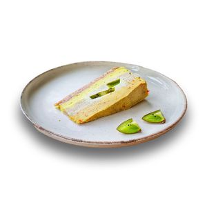 Delight your senses with a delicious raw cake that harmoniously combines the fresh and vibrant taste of kiwi, the refreshing acidity of lemon, and the exotic sweetness of mango.  at Vegasmo in Brasov