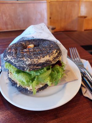 Bagel 'Orient' with hummus, tomato, salad, grilled beetroot, dressing (7.60) at Bagel Coffee Culture in Berlin