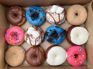 Assorted 12-pack of vegan donuts 🍩 Flavors: Chocolate-covered strawberry, Cookie Monster, Hot Cocoa, Maple Sugar, the ‘Homer’ (pink sprinkle), Red velvet. #Veganuary at Monster Baby Donuts - Pop up in Columbus