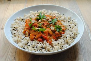 MAFE - african goulash with carrot, pepper, tomatoes, green lentils and peanut butter. Served with brown rice, black sesame and nuts. at Vega in Wroclaw
