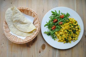 Masala tofu scramble with naan bread. Tofu scrambled on olive oil. Seasoned with mixed Indian spices and onion. Served with home­baked Arabic flatbread. at Vega in Wroclaw