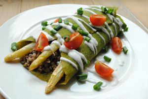 Spinach pancake with buckwheat, mushrooms and asparagus filling. at Vega in Wroclaw