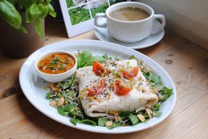 Green lentils soup and burrito chili sin carne with rice, tomato-vegan cheese sauce. at Vega in Wroclaw