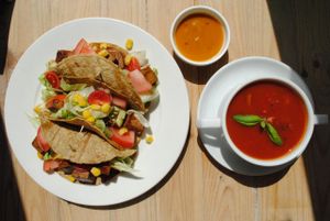 Tomato soup with basil and tacos with marinated tofu, hoisin sauce and vegetables. at Vega in Wroclaw