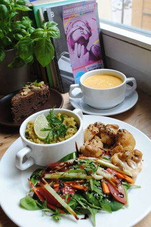 Celery-lemon soup with coconut milk and kitchari with cumin, lime leaves, baked cauliflower, nutty sauce and green salad. at Vega in Wroclaw