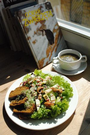 Squash soup with parsley and sesame; salad with dry tofu, pear, avocado, apple-garlic dressing and pumpkin bread. at Vega in Wroclaw