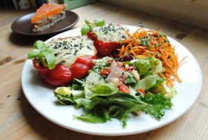 Pepper with lentils, beans and couscous filling, with cheese sauce. at Vega in Wroclaw