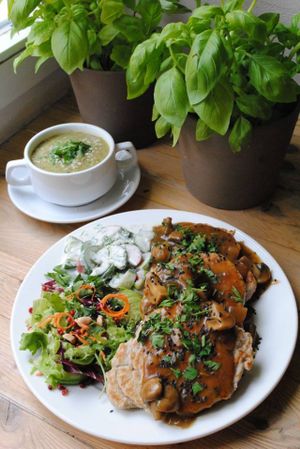 Celery-parsley-dill soup and buckwheat blins with mushrooms sauce and salad.  at Vega in Wroclaw