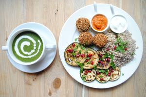 Spinach-millet soup; grilled aubergine and zucchini with buckwheat, vegan cream, banana ketchup with falafels. at Vega in Wroclaw