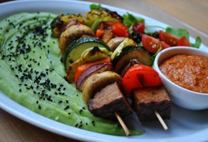 Roasted shashliks with tempeh, cabbage, mushrooms, zucchini, pepper and onion; broccoli-potato puree and BBQ sauce. at Vega in Wroclaw