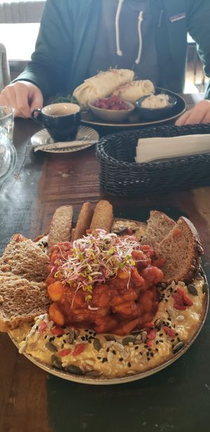 Front hummus and baked beans with tempeh. Back scrambled tofu wrap with two sauces. Both were very good. at Vega in Wroclaw