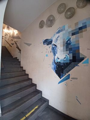 Cute cow and at stairs to upper floor at Vega in Wroclaw