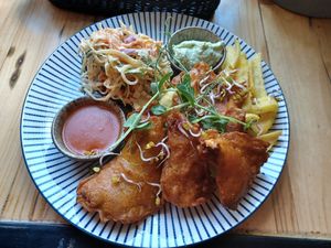 Crispy oyster mushrooms, fried potato "boats", coleslaw, aioli, gochugaru soo fatty, hangover prevention at Vega in Wroclaw