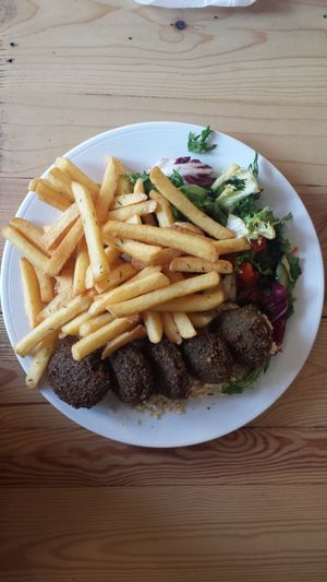 Falafels with hummus, fries and salad at Vega in Wroclaw
