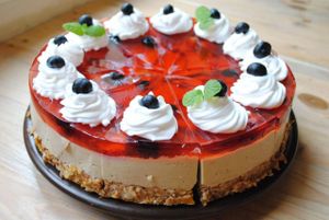 Mocha tofucake with nutty base, strawberry jelly and fruits. Gluten free. at Vega in Wroclaw