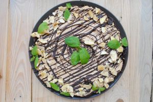 Chocolate cake with peanuts cream and banana crisps. at Vega in Wroclaw