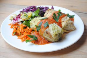 Stuffed cabbage with buckwheat, zucchini and aubergine and tomato sauce. at Vega in Wroclaw