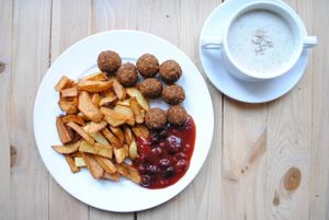 Tofuball with dill, chips and cranberry sauce. at Vega in Wroclaw