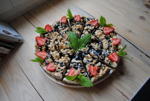 Raw food cake with strawberry, peanuts and chocolate with nutty base. at Vega in Wroclaw