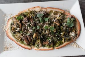 greens on flatbread: cashew pesto, garlic, dark greens, broccoli, chives, brussels, onions, mushrooms, white wine at Zest Kitchen & Bar in Salt Lake City