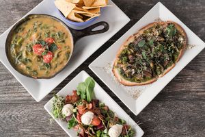3 appetizers from our dinner menu, spinach, asparagus cheese dip, roasted root veggie (beets, sunchokes, squash) salad w/chive cashew spread, greens on flatbread at Zest Kitchen & Bar in Salt Lake City