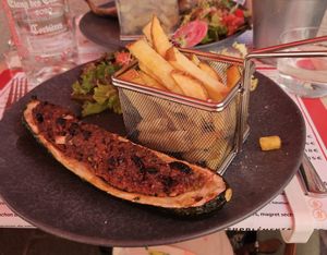 Stuffed eggplant, with salad and fries. at le Café de la Comédie in Carcassonne