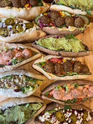 Vegan baguettes, falafel & hummus, bean salsa, lime dressing & jalapeños, sweet potato pakora, roasted red pepper dressing,  olive tapenade, green olive & sun dried tomato & pesto at Wapping Sourdough in East London