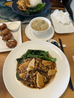 Crab cake left, minced meat noodles right with dumpling soup  at Clover Plant Based Kitchen & Bar  in Central Singapore