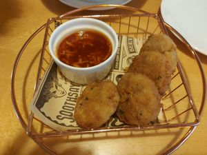 Crab cakes at Clover Plant Based Kitchen & Bar  in Central Singapore