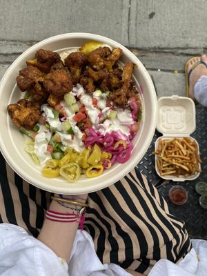 cauliflower on salad with fries at Taïm - Nolita in New York City